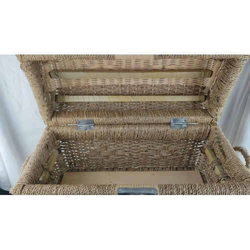 415 - Woven rattan storage trunk with a metal clasp. Features intricate weave pattern and sturdy construct... 