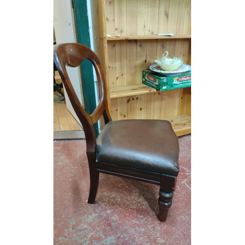 421 - Victorian mahogany balloon-back nursing chair with brown upholstered seat, featuring turned legs and... 