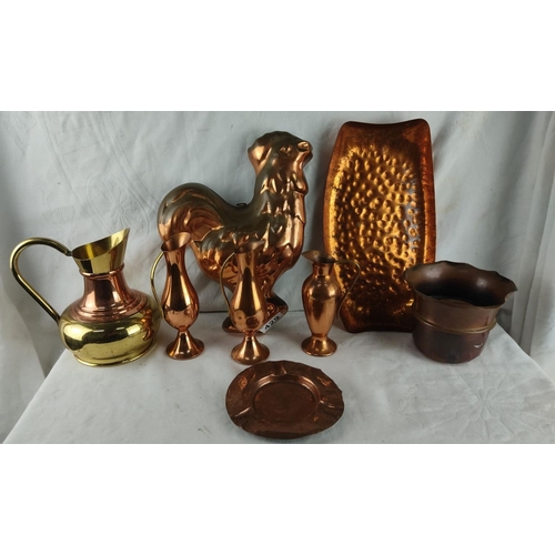 429 - Copper and brass decorative lot including rooster mold, pitchers, and tray. Rich patina highlights v... 