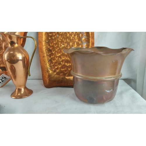 429 - Copper and brass decorative lot including rooster mold, pitchers, and tray. Rich patina highlights v... 