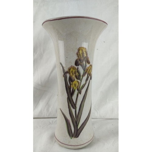 434 - Ceramic vase with iris motif, glazed finish, featuring a crown hallmark on the base. From the early ... 