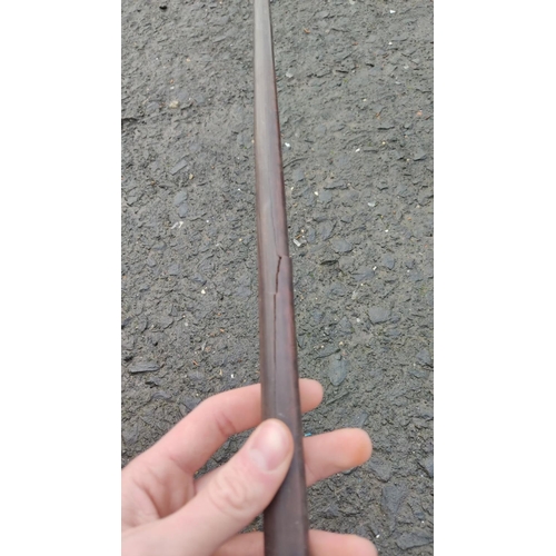 440 - An antique rosewood javelin, measuring approx 210cm