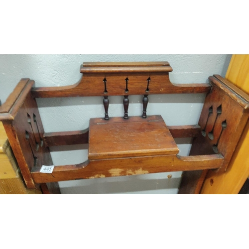 445 - Oak umbrella stand with pierced back and turned supports, featuring lower drip tray.