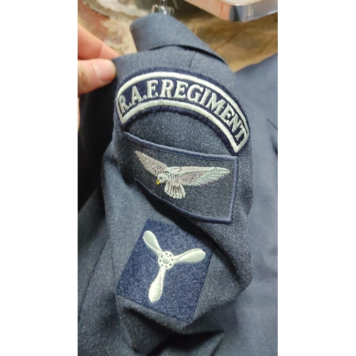 450 - 2 Royal Air Force uniform jackets, featuring brass buttons with crown and eagle insignia. Dark blue ... 