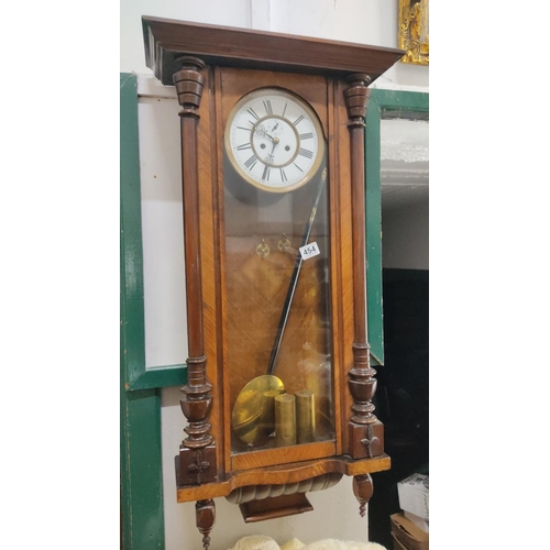 454 - An antique double weight Vienna clock.