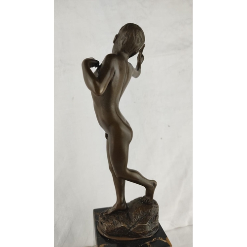 461 - Stunning Bronze sculpture of a boy, poised on a black marble base.