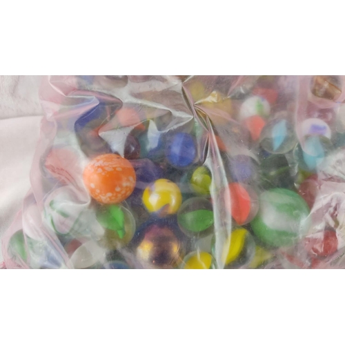 472 - Collection of assorted vintage glass marbles in various colours and patterns, packaged in a resealab... 