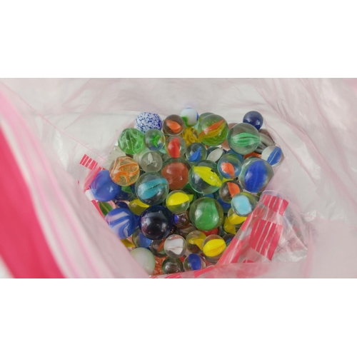 472 - Collection of assorted vintage glass marbles in various colours and patterns, packaged in a resealab... 