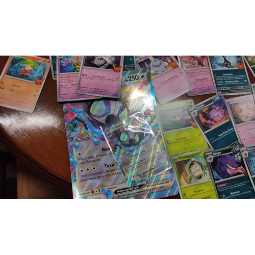 473 - Collection of assorted Pokémon trading cards featuring various characters and styles, including holo... 