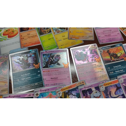 473 - Collection of assorted Pokémon trading cards featuring various characters and styles, including holo... 