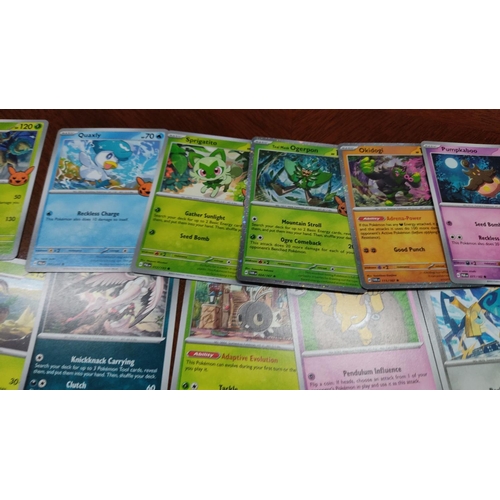 473 - Collection of assorted Pokémon trading cards featuring various characters and styles, including holo... 