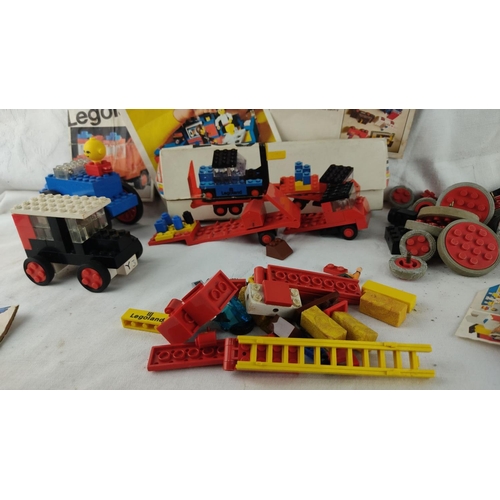 474 - Vintage Lego Sets with original box and instruction manuals, including various building pieces, whee... 