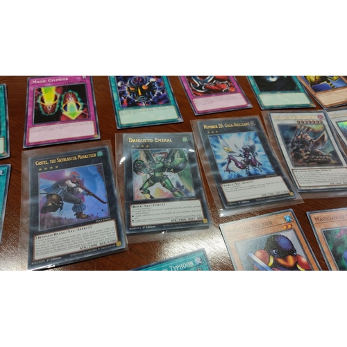 475 - Collection of Yu-Gi-Oh! trading cards, featuring Castel, the Skyblaster Musketeer and Daigusto Emera... 