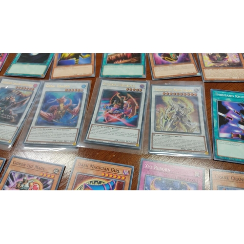 475 - Collection of Yu-Gi-Oh! trading cards, featuring Castel, the Skyblaster Musketeer and Daigusto Emera... 