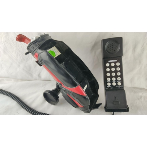 478 - Novelty Betacom golf bag-shaped phone features a vintage design with coiled cord and detachable hand... 