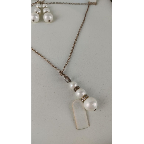 481 - Pearl necklace and earring set with silver chain and crystal accents, displayed in a presentation bo... 