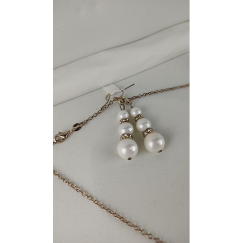 481 - Pearl necklace and earring set with silver chain and crystal accents, displayed in a presentation bo... 