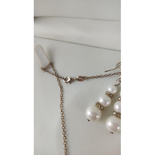 481 - Pearl necklace and earring set with silver chain and crystal accents, displayed in a presentation bo... 