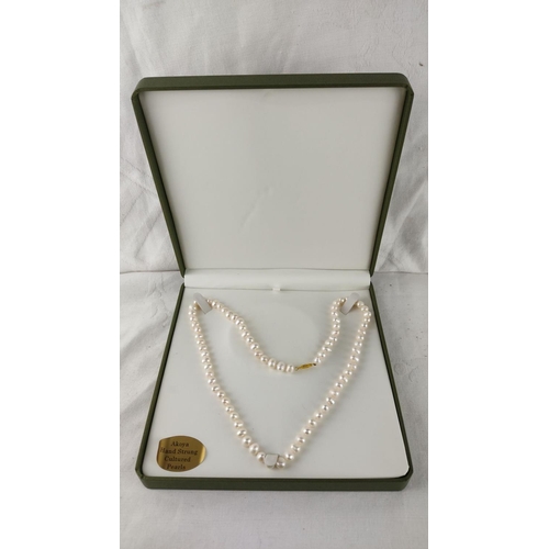 483 - Akoya hand-strung cultured pearl necklace features a delicate gold clasp. Presented in original disp... 