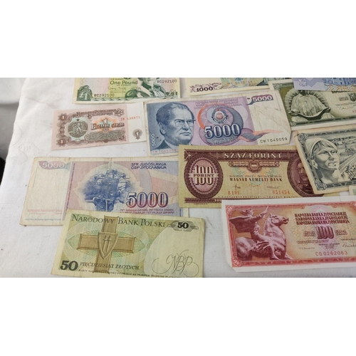 484 - Collection of international banknotes, featuring currencies from Argentina, Poland, Yugoslavia, and ... 