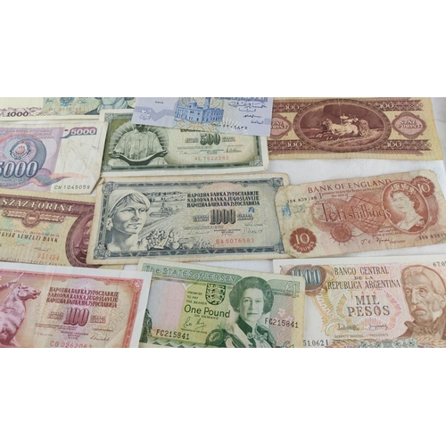 484 - Collection of international banknotes, featuring currencies from Argentina, Poland, Yugoslavia, and ... 