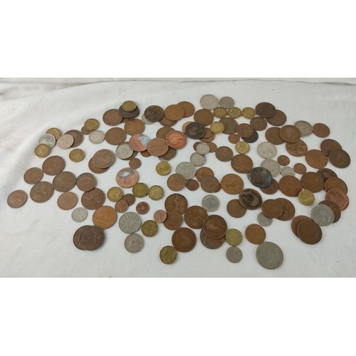 485 - Mixed lot of assorted coins, featuring various historical and international designs, highlighting di... 