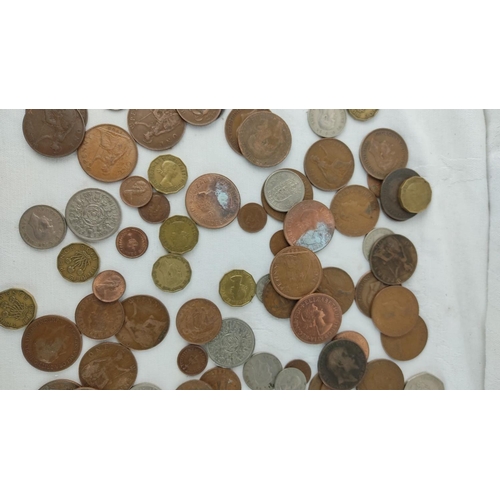 485 - Mixed lot of assorted coins, featuring various historical and international designs, highlighting di... 