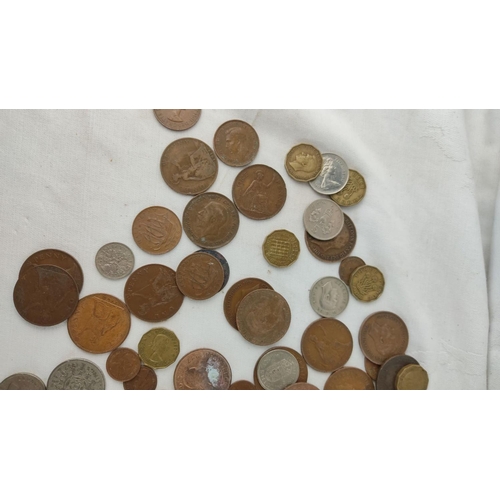 485 - Mixed lot of assorted coins, featuring various historical and international designs, highlighting di... 