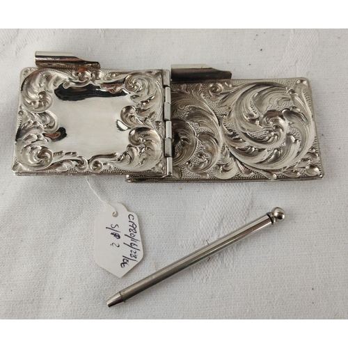 491 - Silver plated notepad holder with intricate scrollwork. Includes matching pen. From the 19th century... 