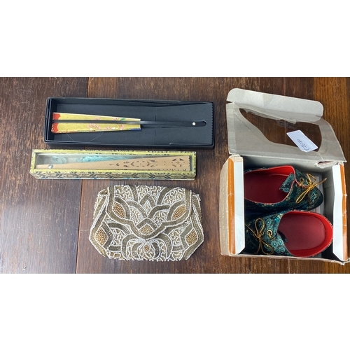 332 - Beaded clutch, decorative folding fan in box, and patterned fabric shoes in original packaging.