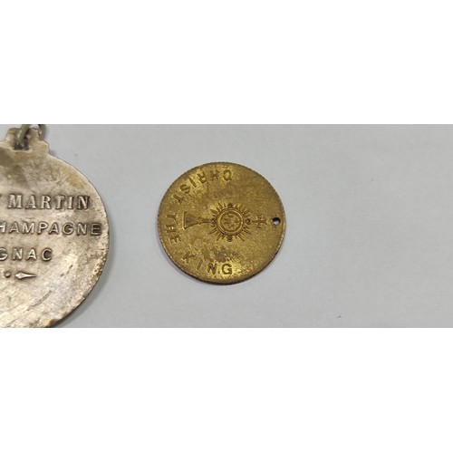 124 - Rémy Martin Fine Champagne Cognac medal and 1932 Dublin Eucharistic Congress souvenir medal.