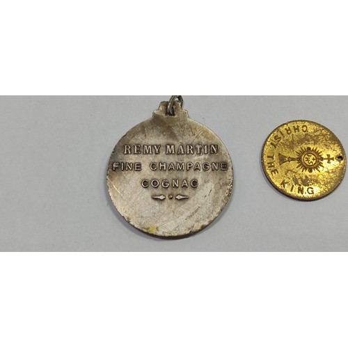 124 - Rémy Martin Fine Champagne Cognac medal and 1932 Dublin Eucharistic Congress souvenir medal.