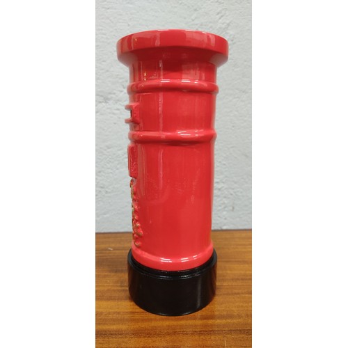 311 - A novelty Royal Mail metal money box. Measuring approx 20cm tall