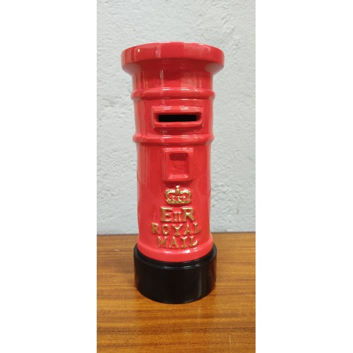 311 - A novelty Royal Mail metal money box. Measuring approx 20cm tall