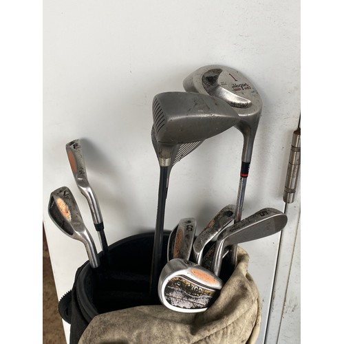 187 - A set of golf clubs.