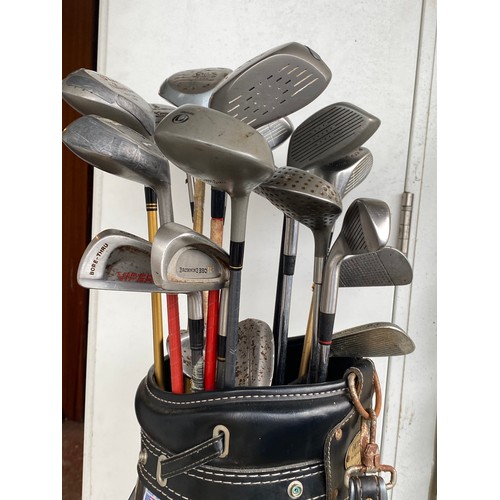 188 - A set of golf clubs.