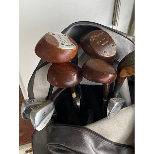 193 - A set of golf clubs.