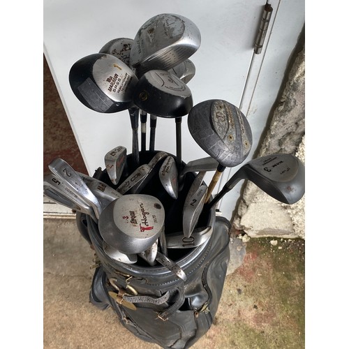 230 - A set of golf clubs.