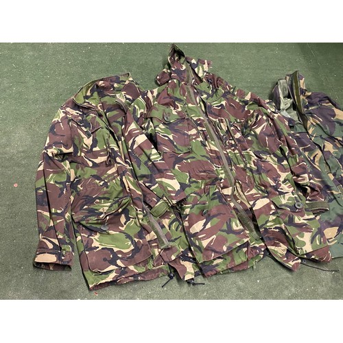 255 - Three army camouflage jackets.