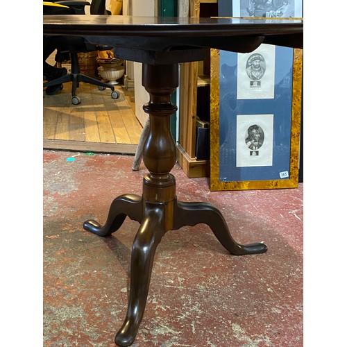 397 - An antique tip overleaf table.