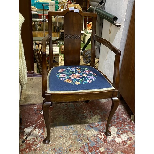 411 - An antique mahogany chair with tapestry seat.