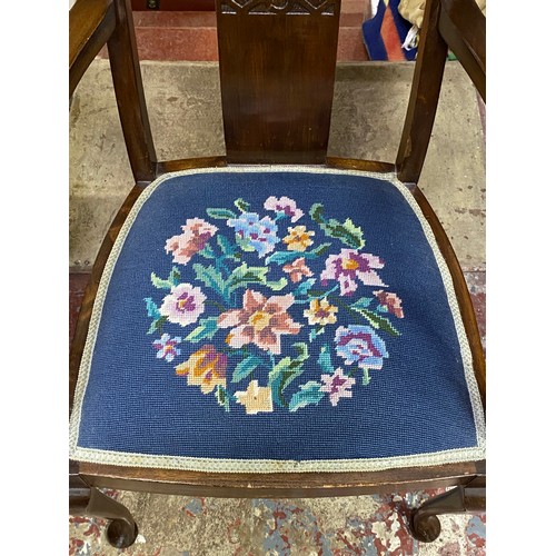 411 - An antique mahogany chair with tapestry seat.