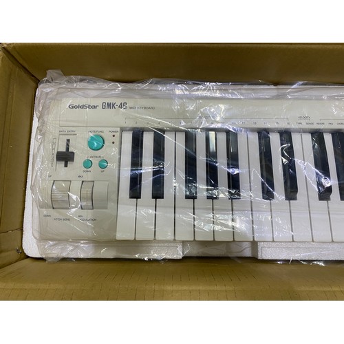 548 - New boxed Goldstar GNK-49 electric keyboard.