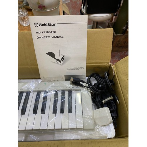 548 - New boxed Goldstar GNK-49 electric keyboard.