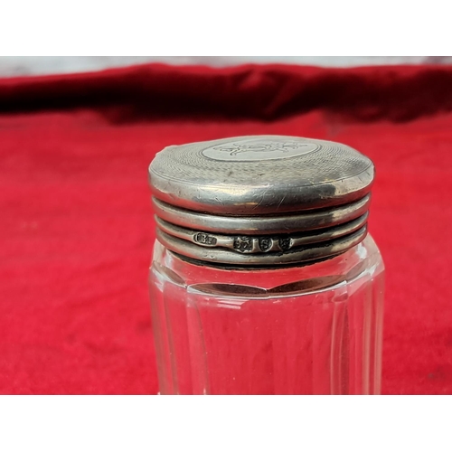 59 - An antique bottle with Sterling Silver topper.