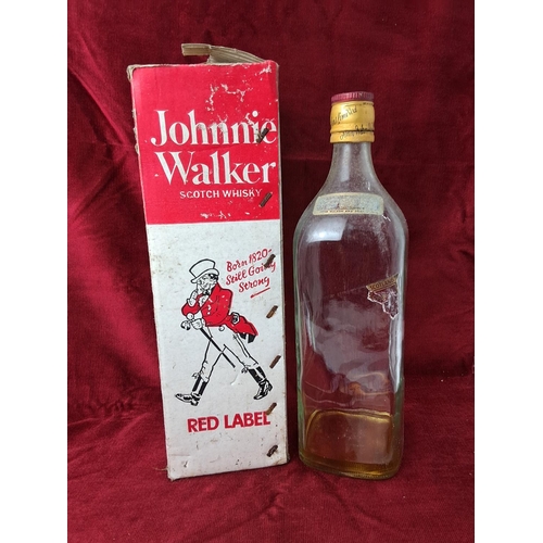 83 - A vintage Johnnie Walker Red Label Scotch Whisky bottle in original card box.