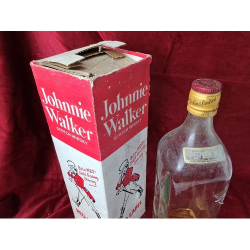 83 - A vintage Johnnie Walker Red Label Scotch Whisky bottle in original card box.