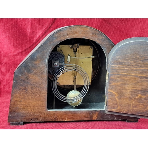 89 - A vintage oak cased clock.