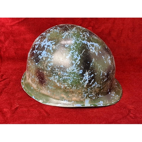 90 - A vintage Military helmet.