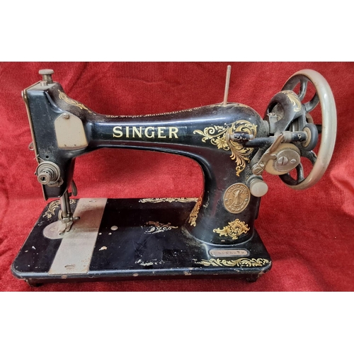 95 - A vintage Singer sewing machine.